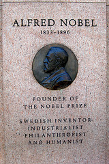 Image of Alfred Nobel Monument consisting of a plaque showing a image of Nobel in profile  listing his name and other relevant information. Alfred was who the Nobel Prizes are named for.